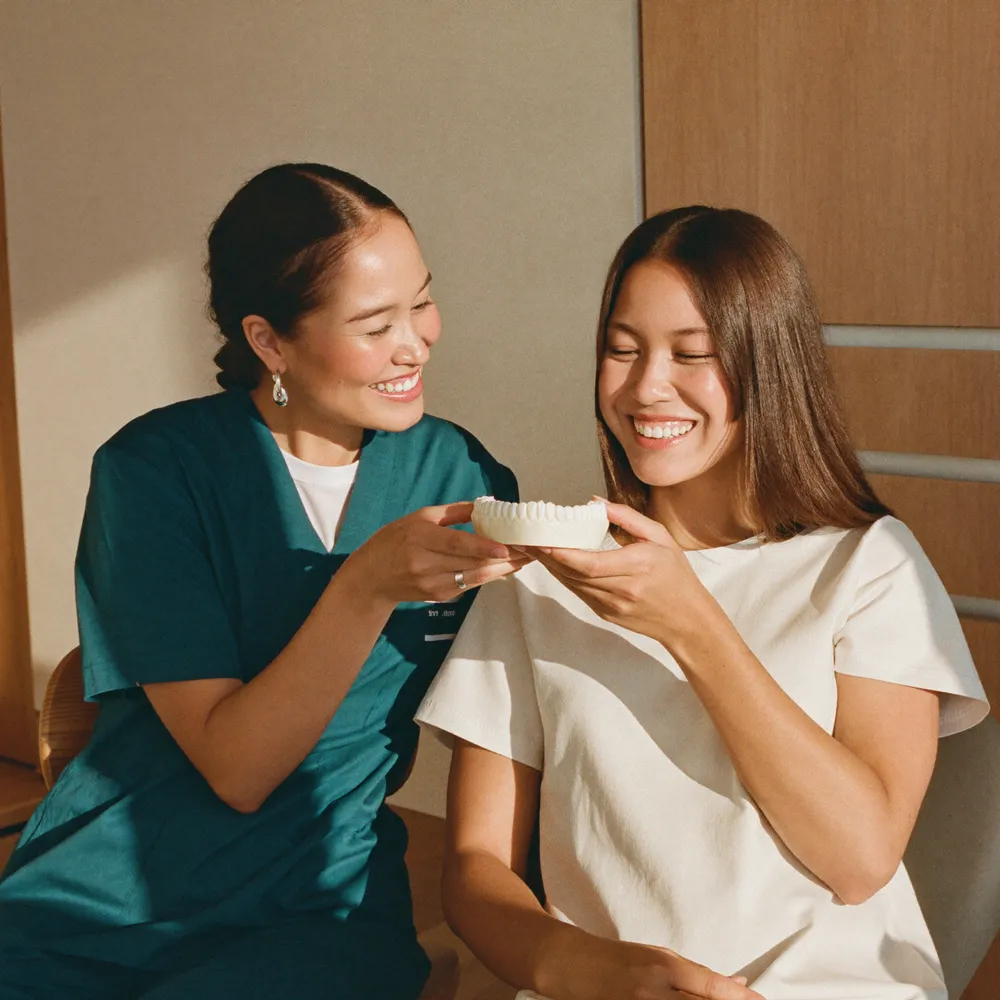Ora orthodontist consulting with a braces patient
